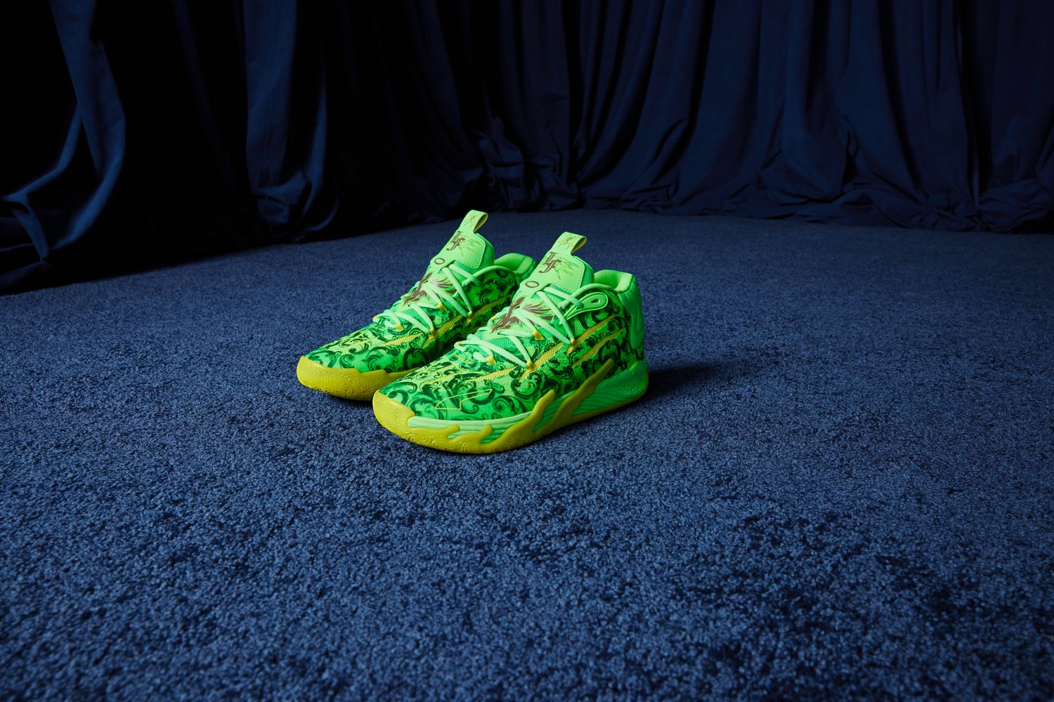 Side view of LaMelo Ball's green and yellow PUMA basketball shoes.